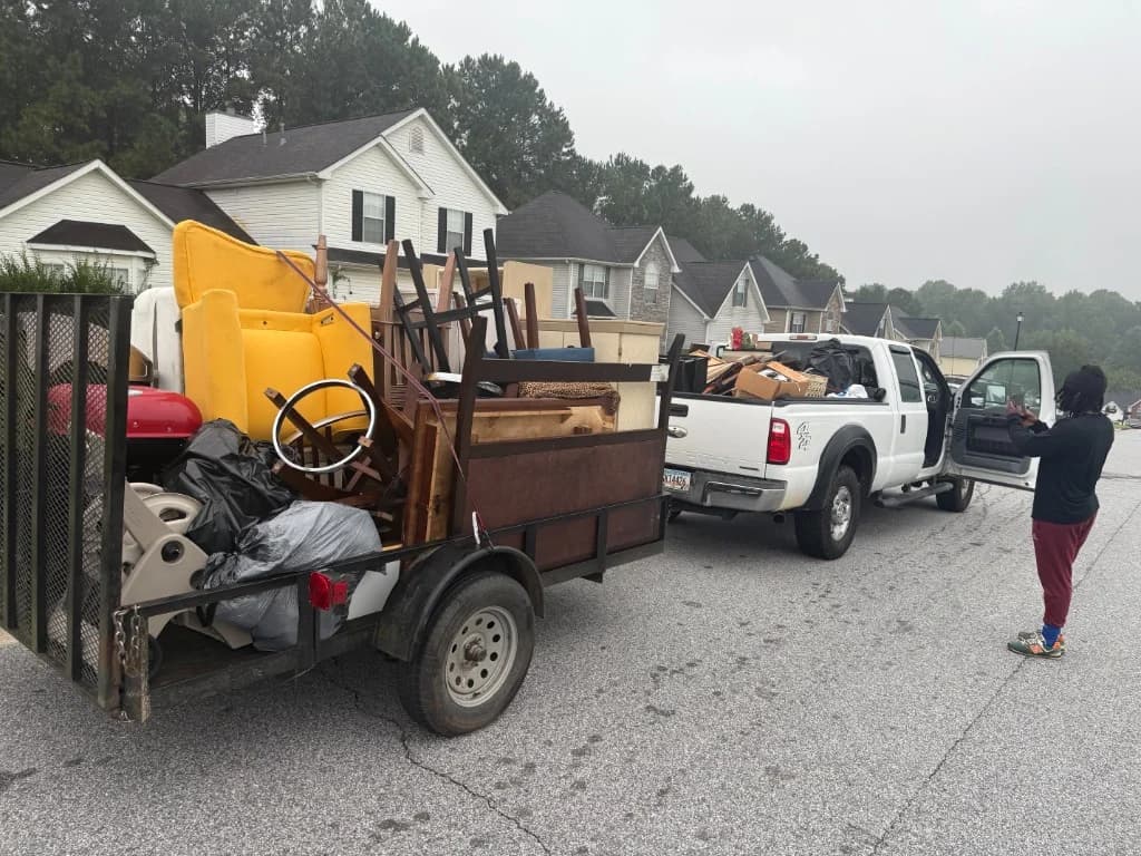 Residential junk load including furniture and household items in a neighborhood